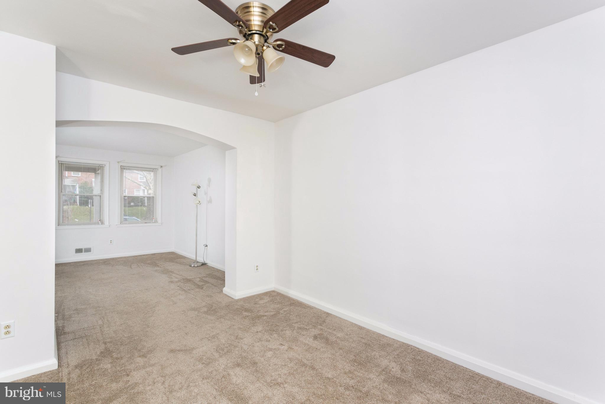 8332 Hillendale Road Baltimore, MD 21234 - Photo 8 of 30 an empty room with chandelier fan