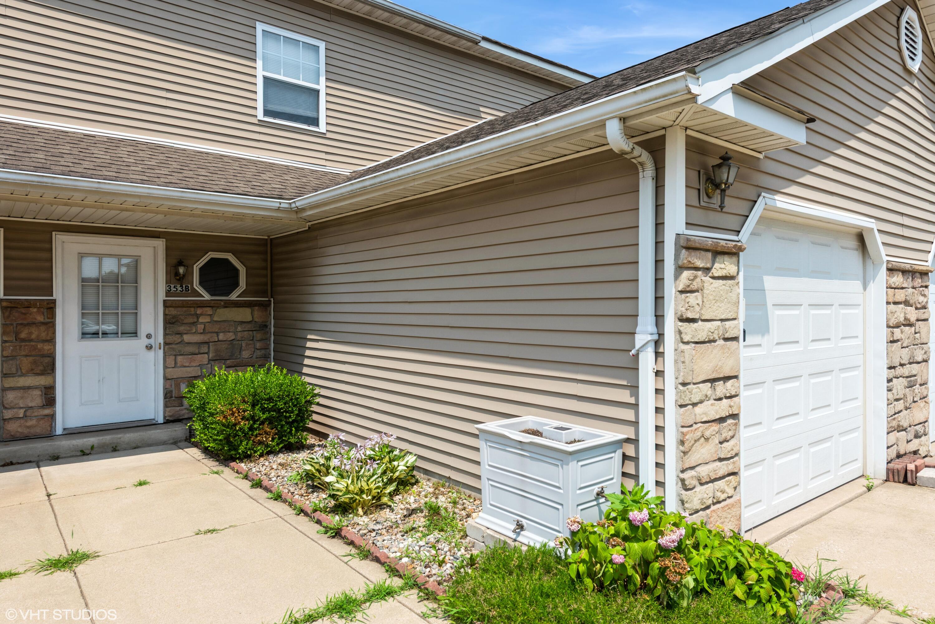 353 South Boo Road, Unit B Burns Harbor, IN 46304 - Photo 1 of 12 a front view of a house with plants