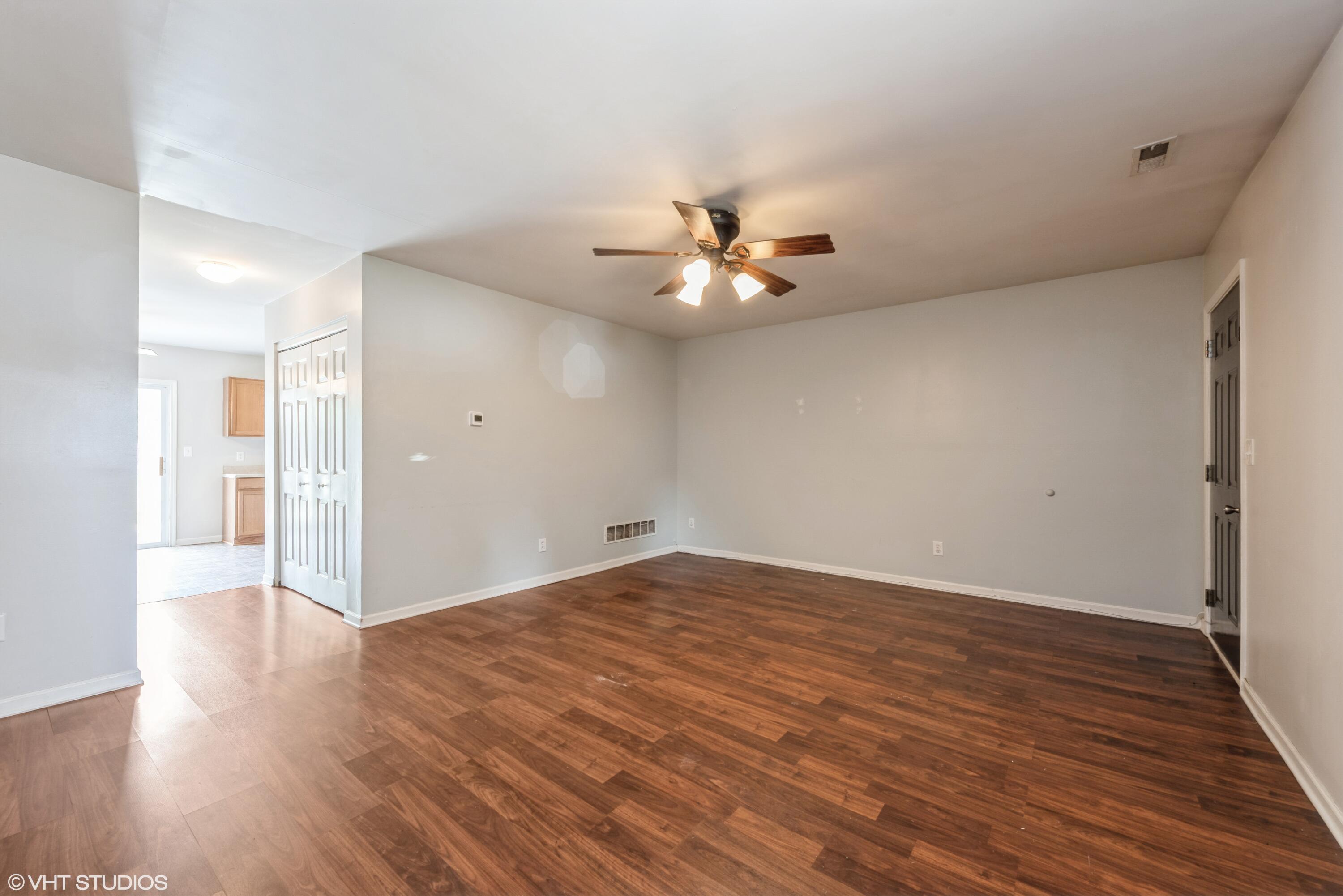 353 South Boo Road, Unit B Burns Harbor, IN 46304 - Photo 2 of 12 a view of an empty room with wooden floor