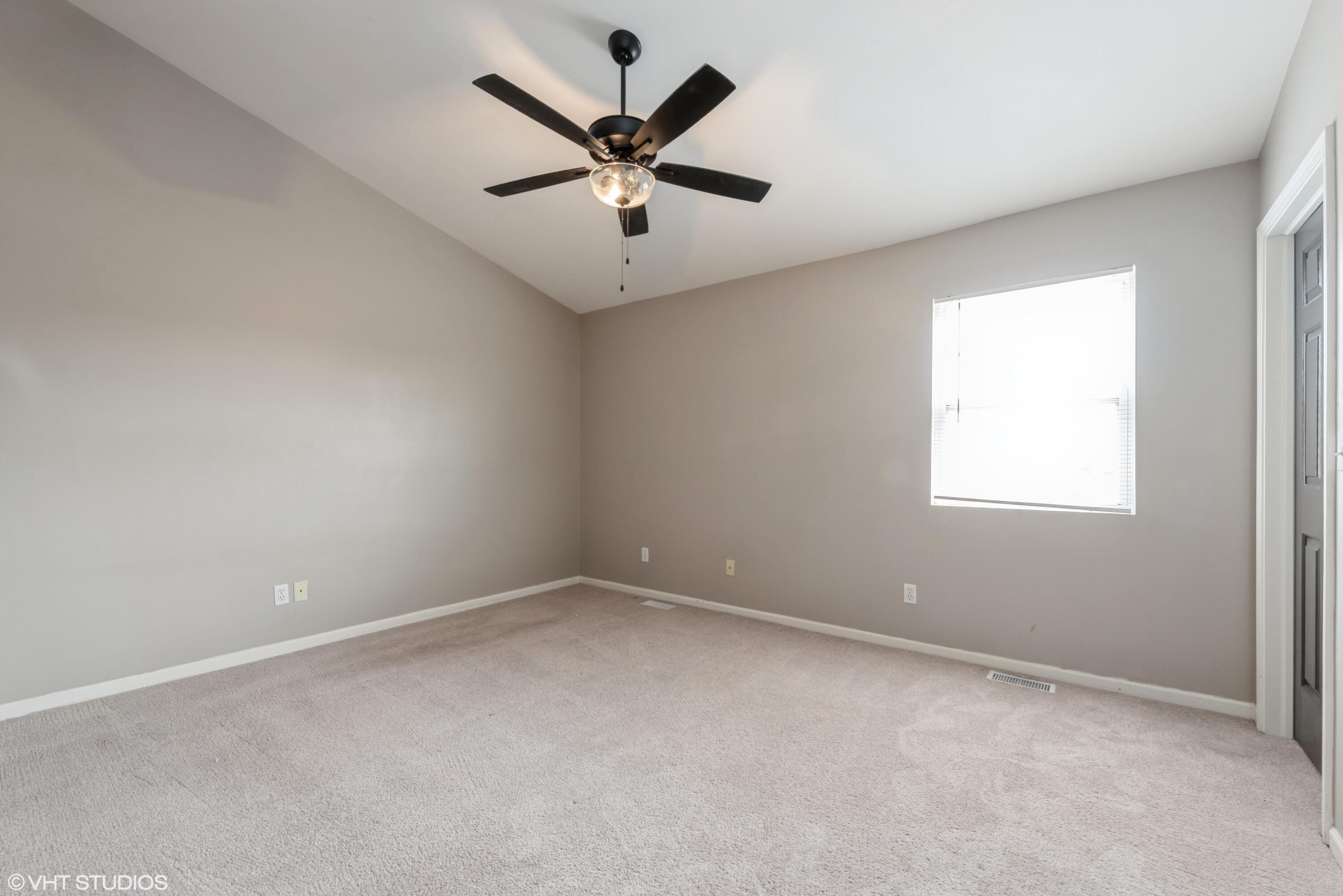 353 South Boo Road, Unit B Burns Harbor, IN 46304 - Photo 6 of 12 an empty room with a window and a fan