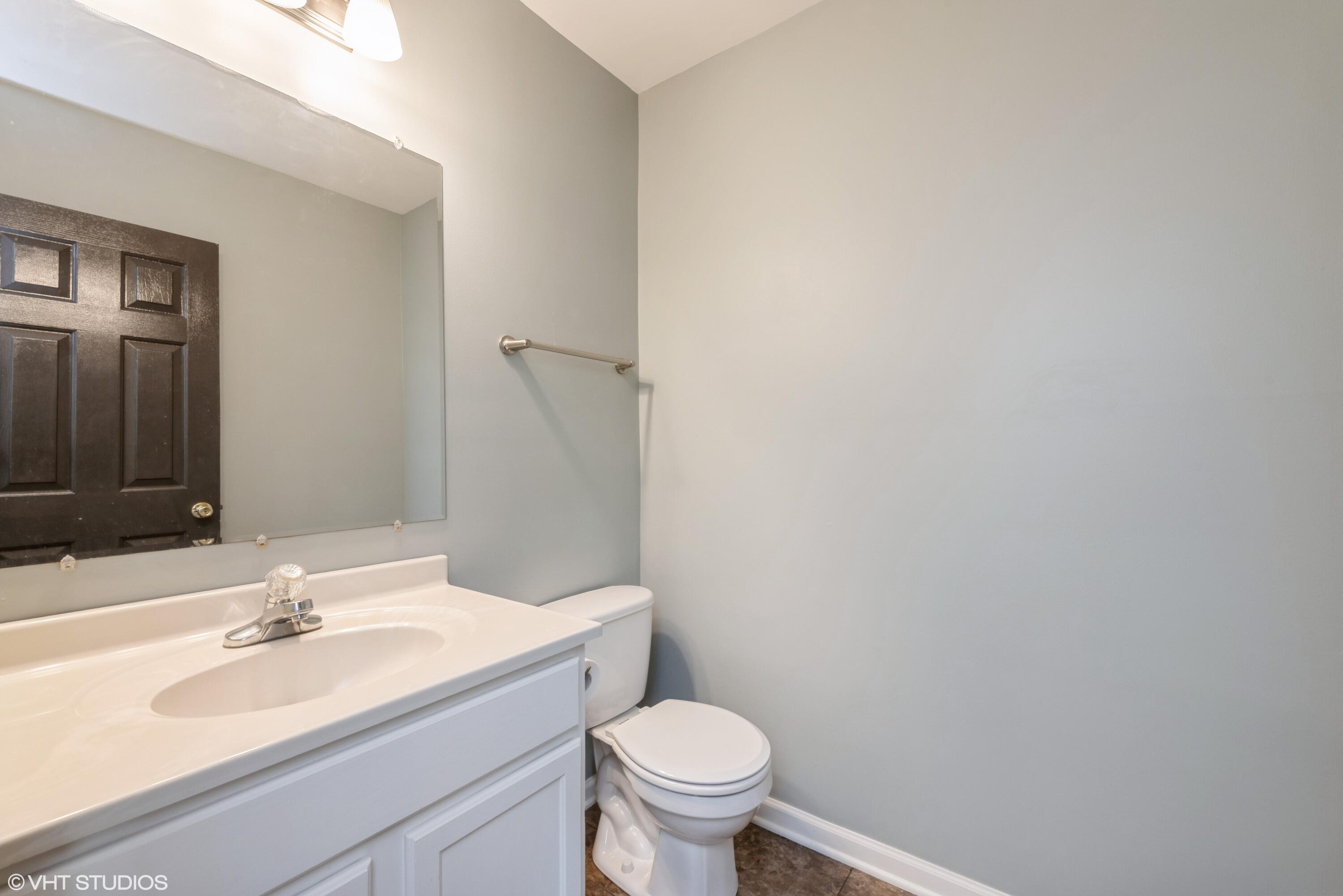 353 South Boo Road, Unit B Burns Harbor, IN 46304 - Photo 10 of 12 a bathroom with a sink and a toilet