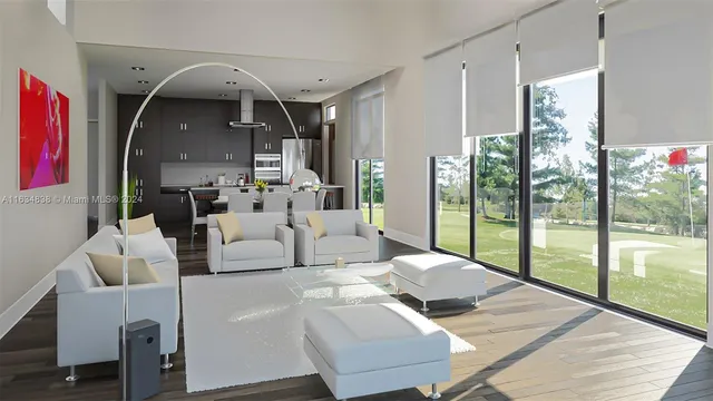 a living room with furniture and floor to ceiling windows