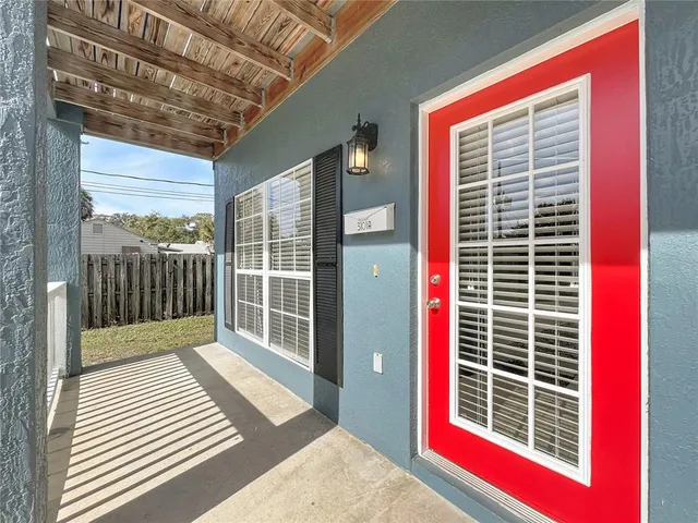a view of a balcony and a floor to ceiling window