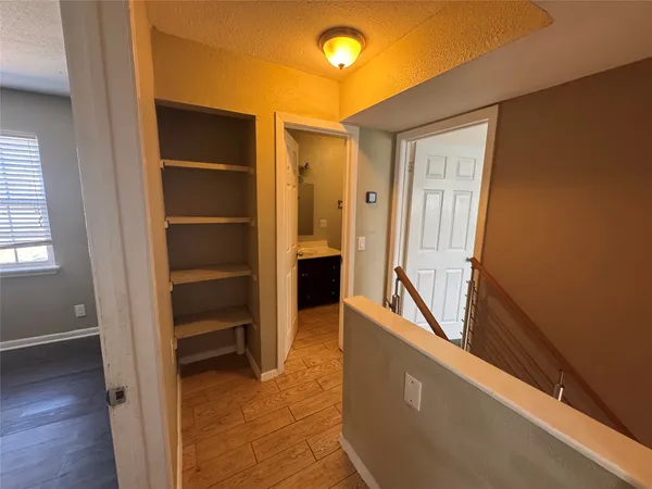 a view of walk in closet with empty room