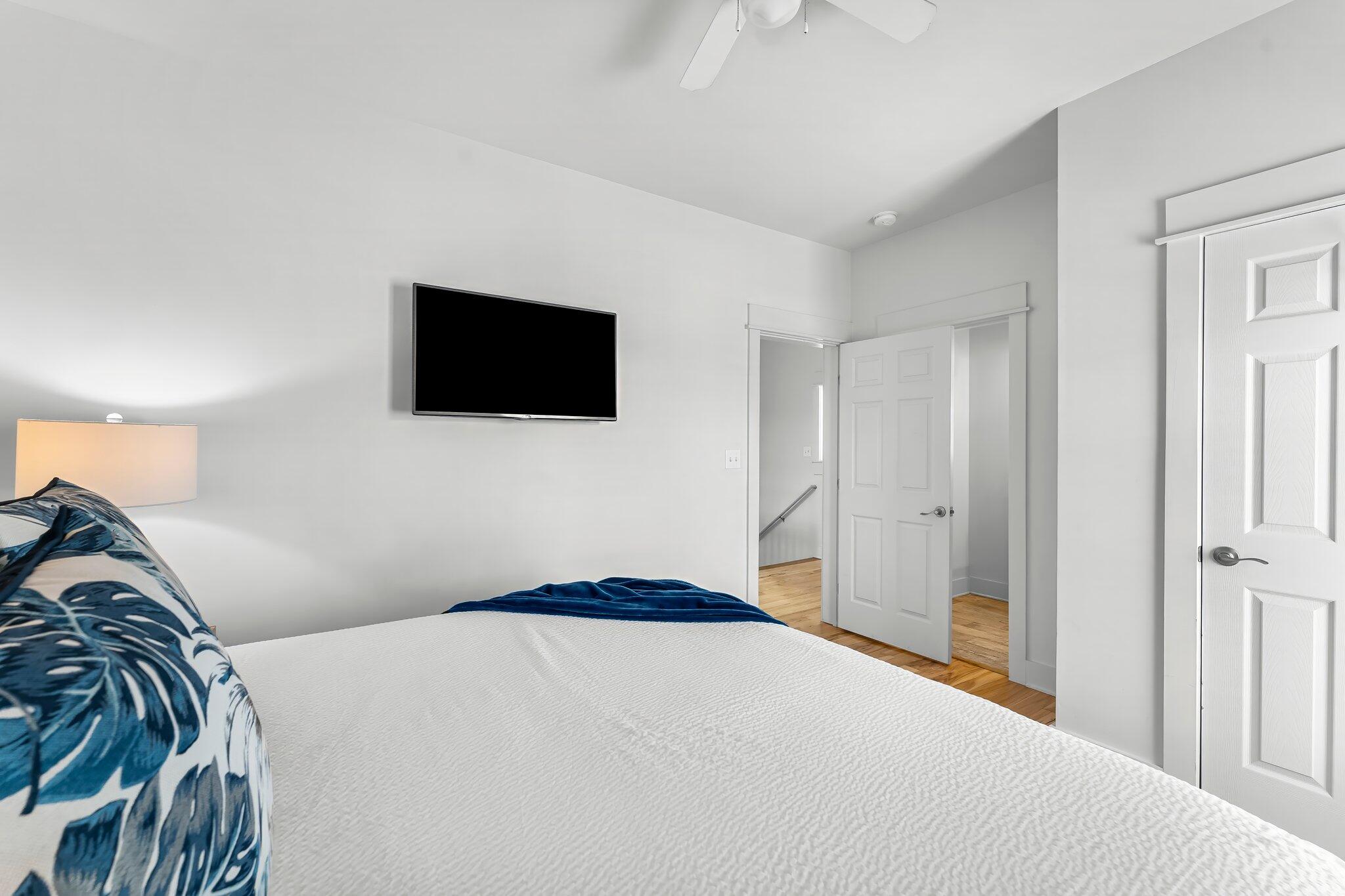98 East Blue Crab Loop Inlet Beach, FL 32461 - Photo 24 of 74 a bedroom with a bed and a flat screen tv