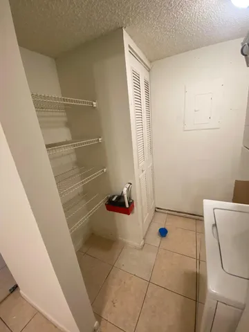 a view of a street with a building in the background