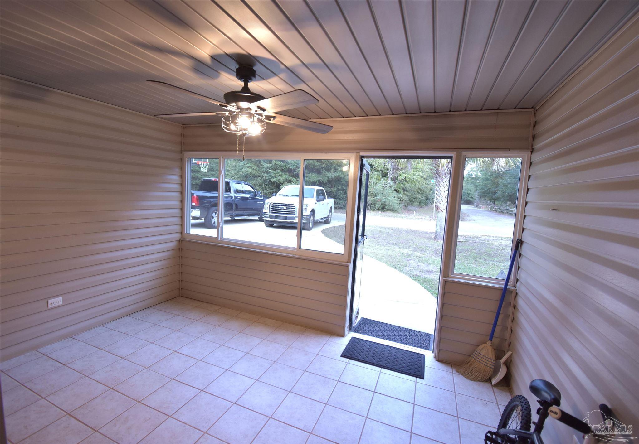 7195 Heath Road Milton, FL 32570 - Photo 7 of 33 a view of room with window and ceiling fan