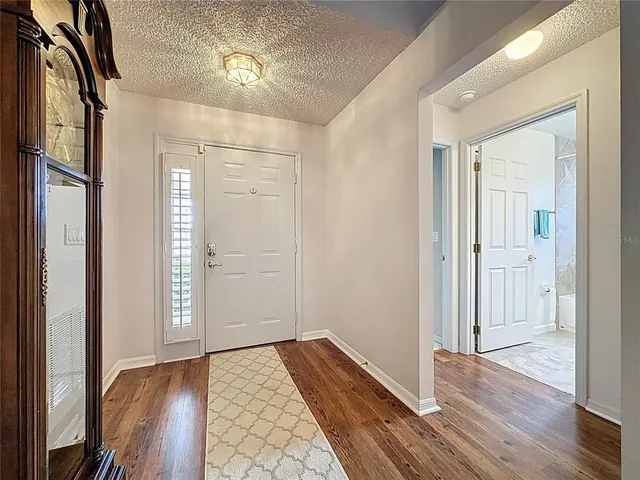 an aerial view of lake residential house and swimming pool