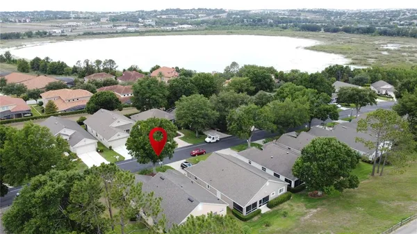 a large hall with stainless steel appliances granite countertop lots of wooden furniture