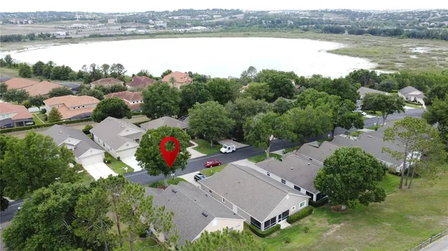 a large hall with stainless steel appliances granite countertop lots of wooden furniture