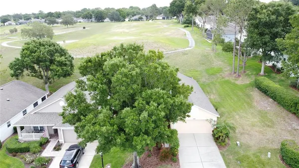 an aerial view of a house with outdoor space