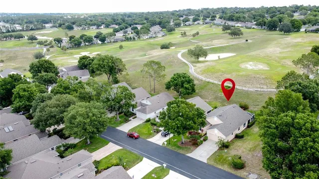 an aerial view of a house with a garden