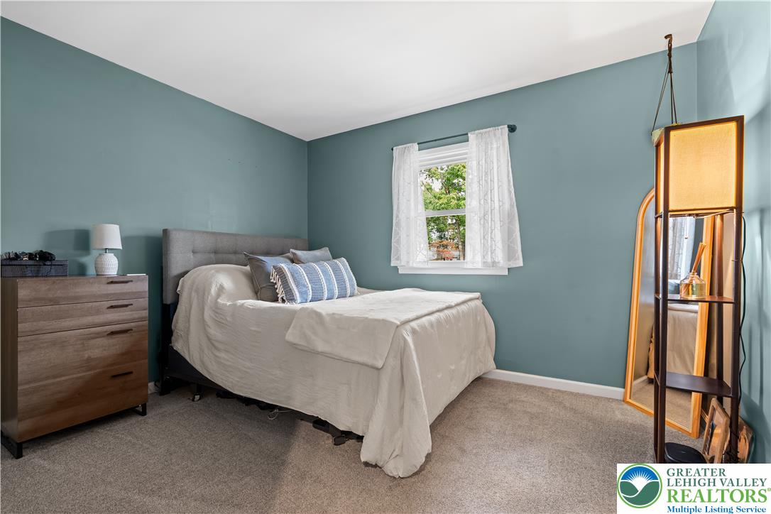 2569 Woods Edge Road Bath, PA 18014 - Photo 16 of 40 Plush wall-to-wall carpeting and a bright window define this cozy bedroom retreat.