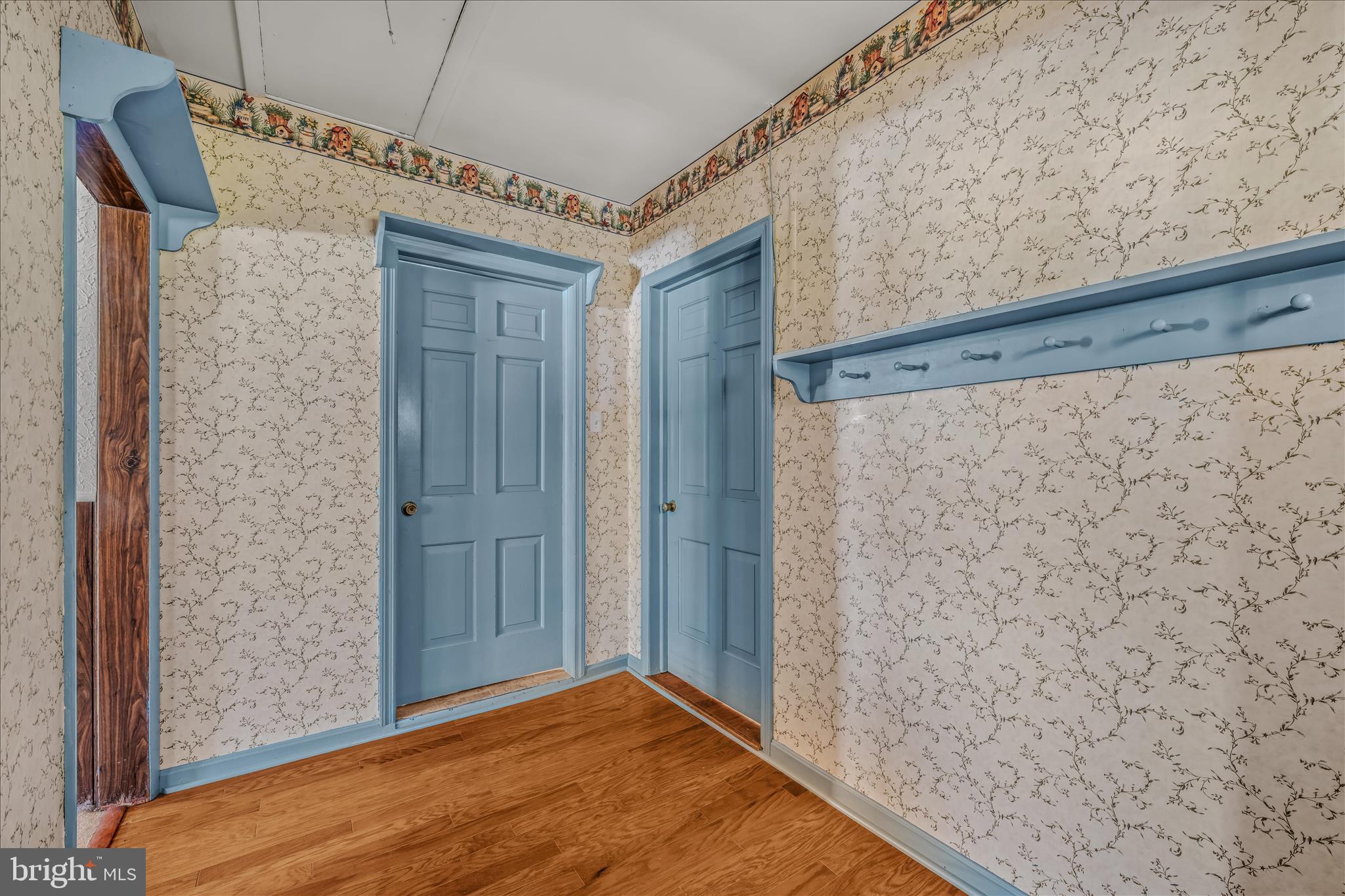 5694 Tabler Station Road Inwood, WV 25428 - Photo 15 of 37 a view of a hallway with wooden floor