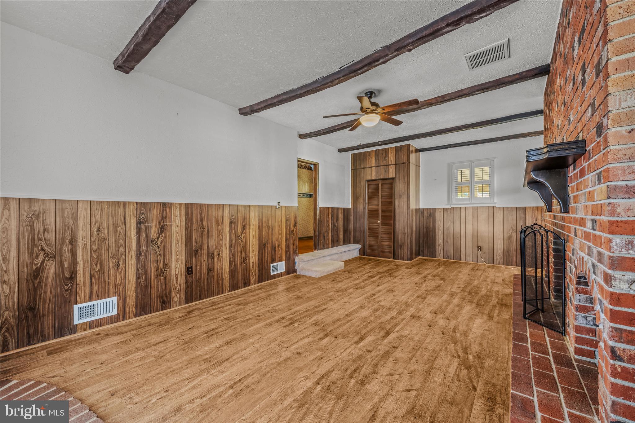 5694 Tabler Station Road Inwood, WV 25428 - Photo 20 of 37 a bedroom with a bed and wooden floor