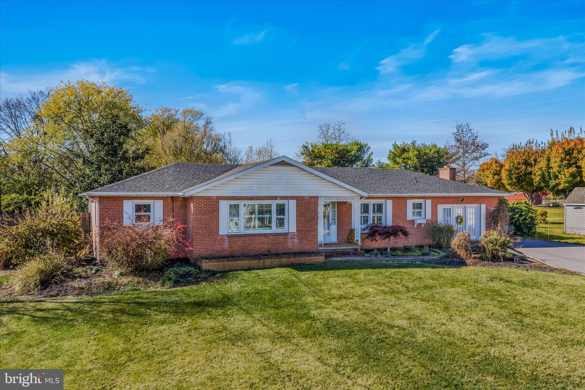 5694 Tabler Station Road Inwood, WV 25428 - Photo 2 of 37 a front view of a house with a garden