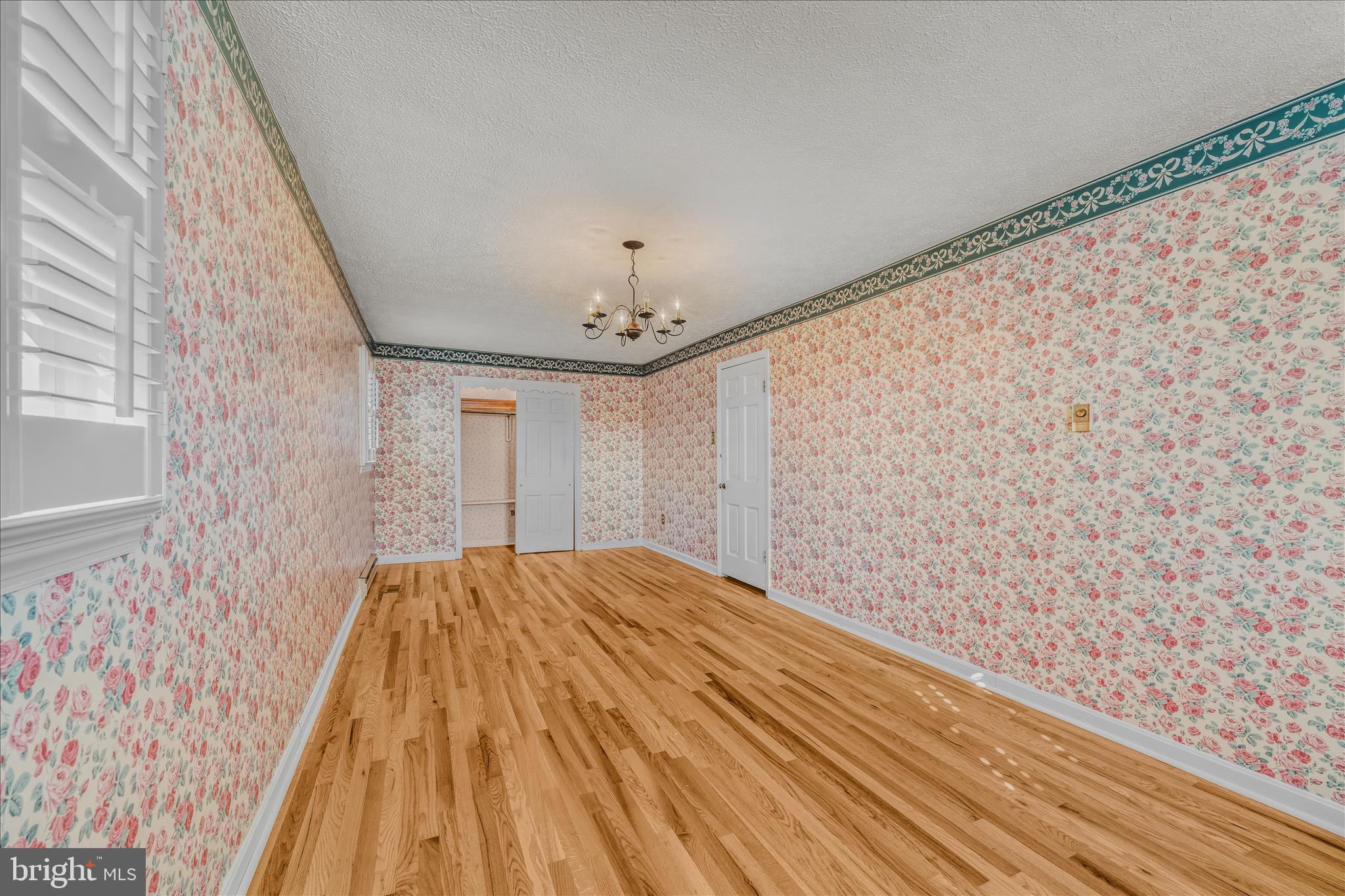 5694 Tabler Station Road Inwood, WV 25428 - Photo 24 of 37 a view of empty room with wooden floor and fan