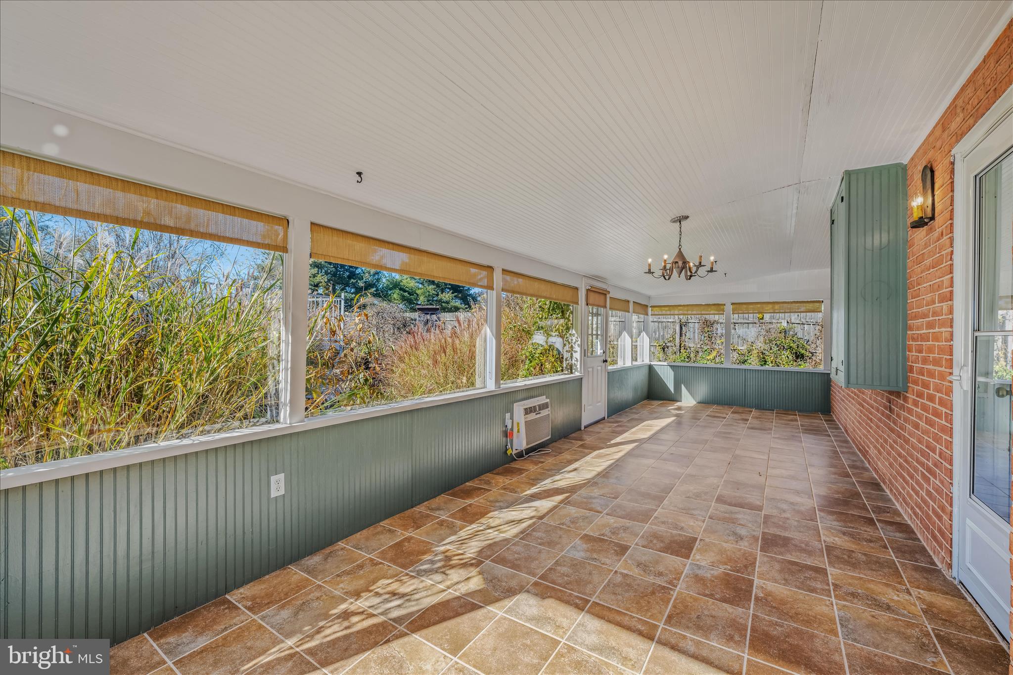 5694 Tabler Station Road Inwood, WV 25428 - Photo 28 of 37 a view of a porch with wooden floor and windows