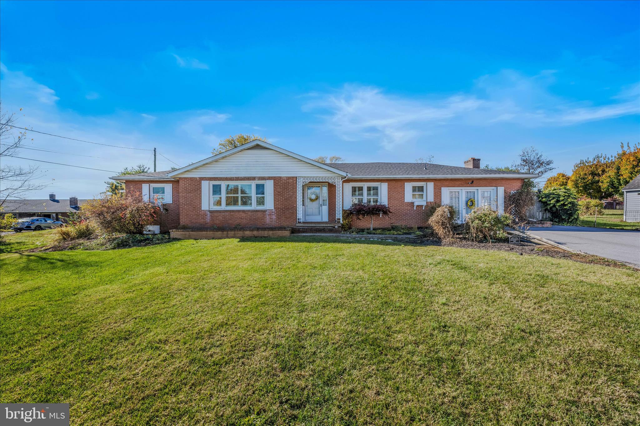 5694 Tabler Station Road Inwood, WV 25428 - Photo 4 of 37 a front view of a house with garden