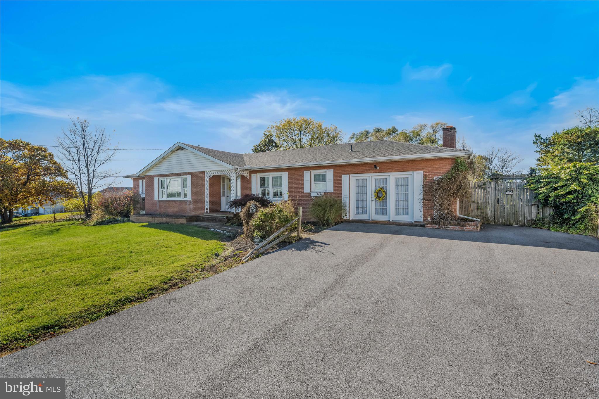 5694 Tabler Station Road Inwood, WV 25428 - Photo 5 of 37 a front view of a house with a yard and garage