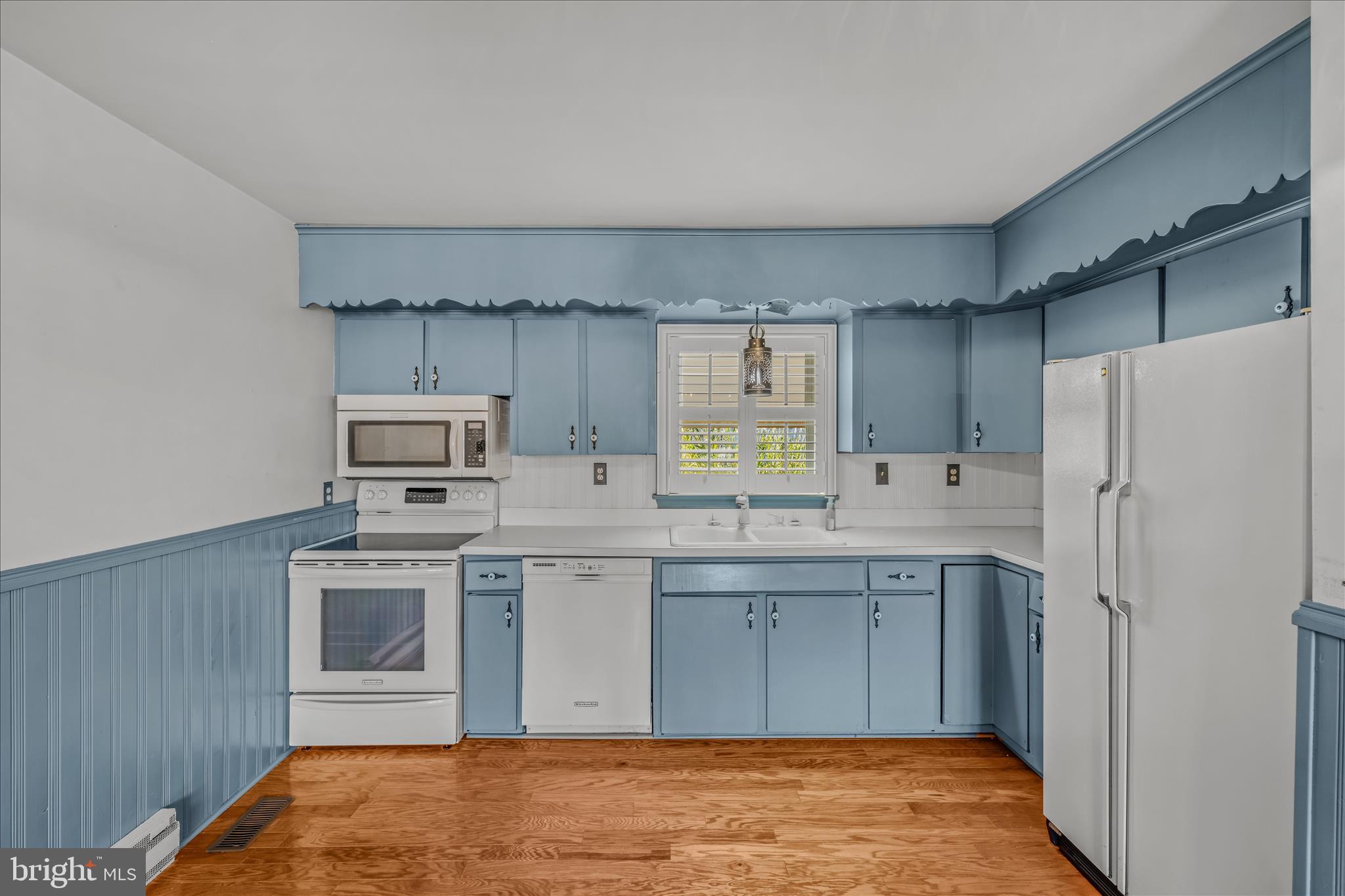 5694 Tabler Station Road Inwood, WV 25428 - Photo 7 of 37 a kitchen with appliances cabinets and a sink