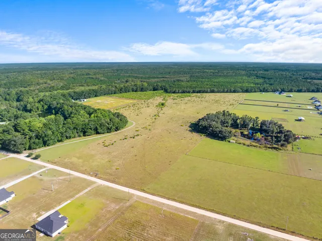 a view of a swimming pool and an outdoor seating