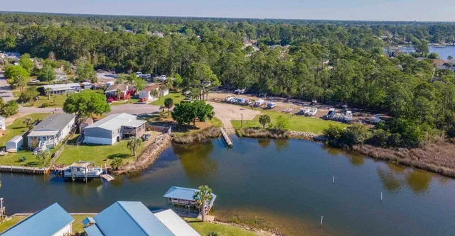 an aerial view of a house with a lake view