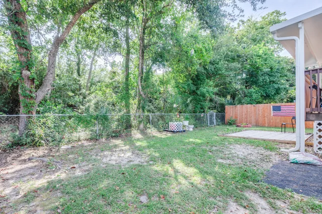 a backyard of a house with lots of green space