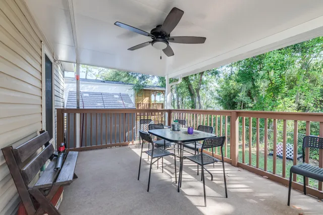 a view of a patio with a table and chairs
