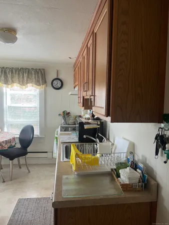 a view of a dining room with furniture and a large window