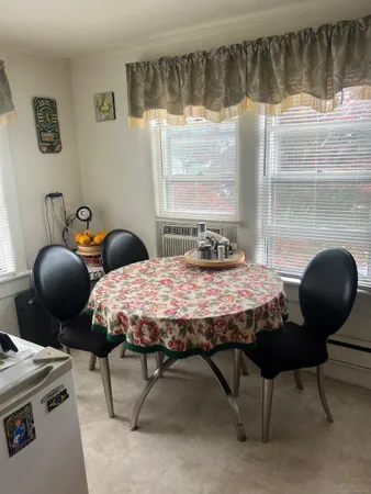 a bedroom with furniture and a window