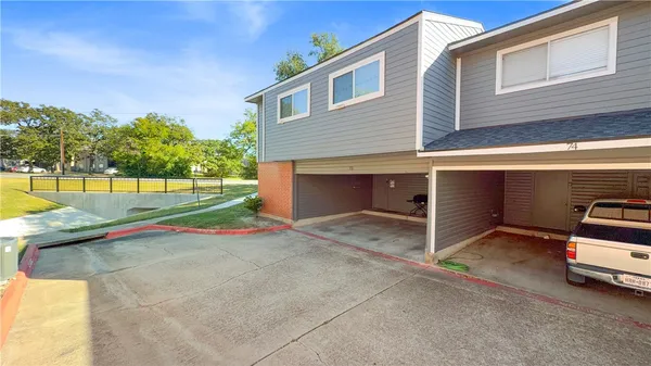 a view of a house with a yard and garage