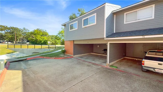 a view of a house with a yard and garage