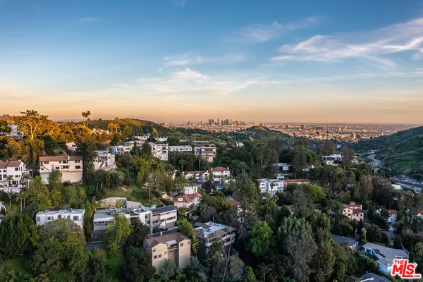a view of a city with green space