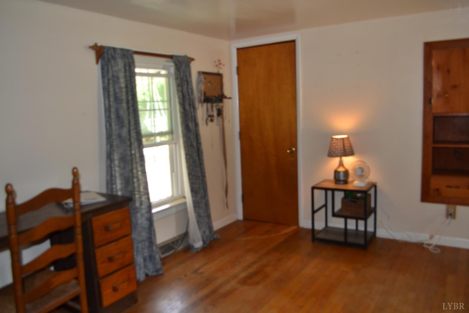 6387 Red House Road Rustburg, VA 24588 - Photo 30 of 38 a living room with furniture and a window