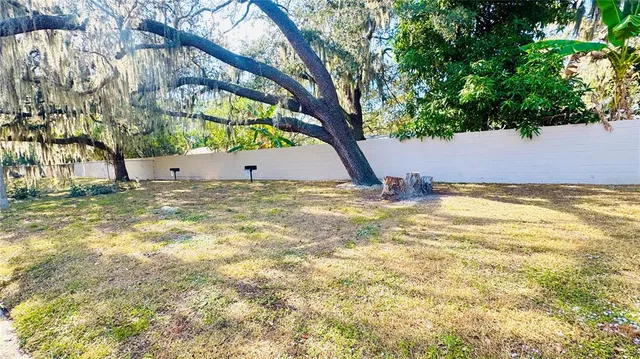 a view of swimming pool with a yard