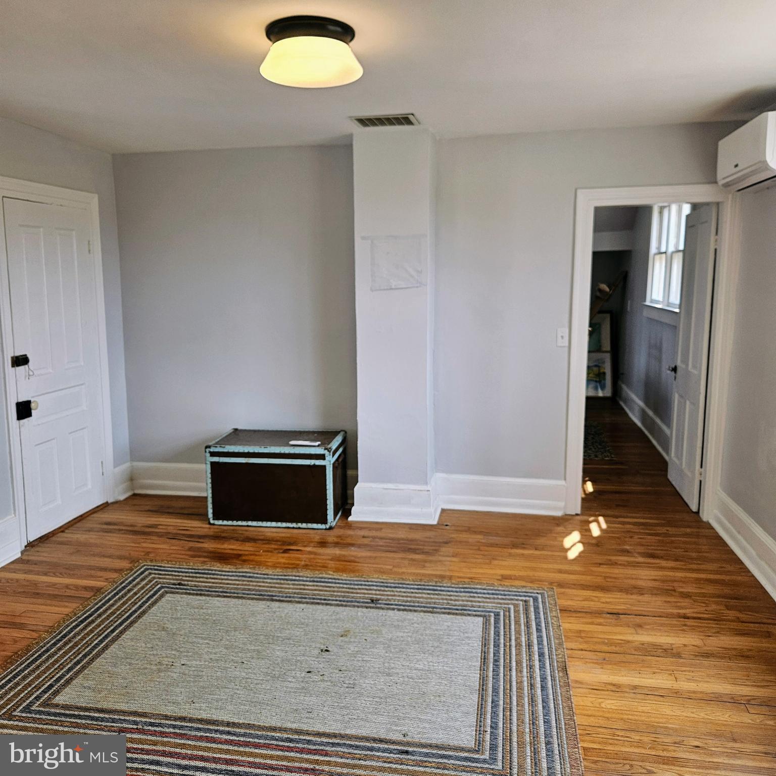 15660 Reva Road Reva, VA 22735 - Photo 21 of 40 a view of an empty room with wooden floor and a window