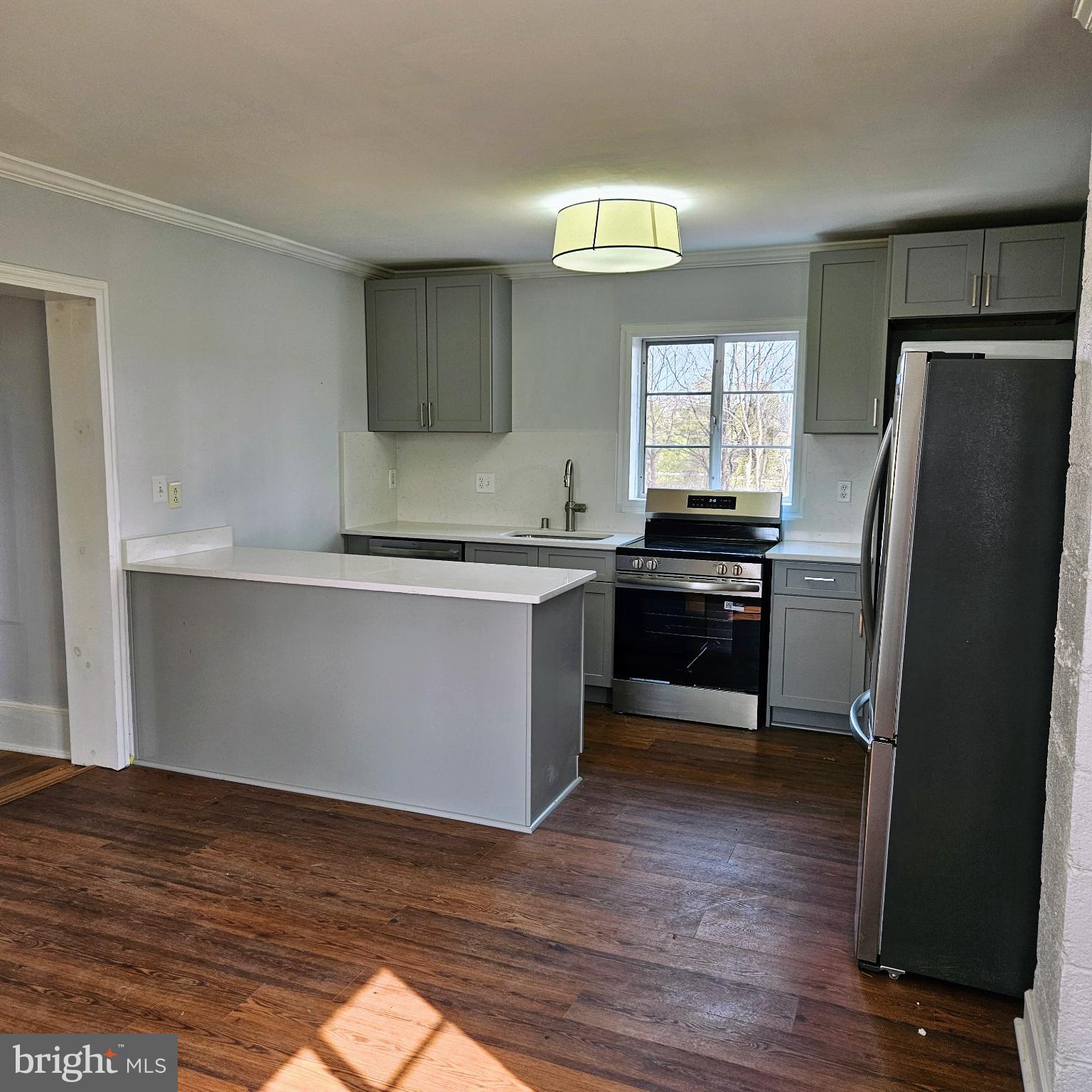 15660 Reva Road Reva, VA 22735 - Photo 28 of 40 a kitchen with a refrigerator and a sink