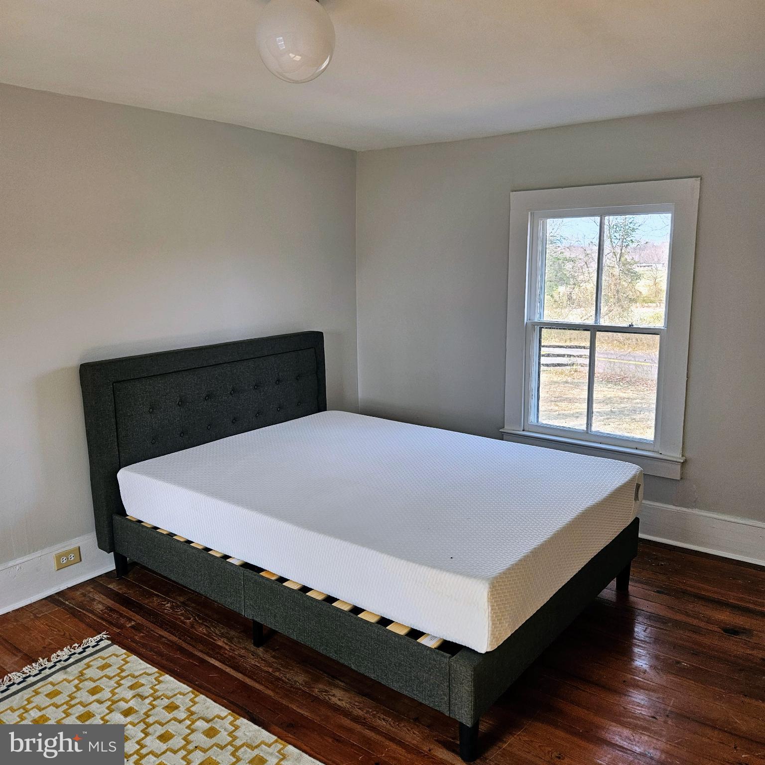 15660 Reva Road Reva, VA 22735 - Photo 34 of 40 a bed sitting in a bedroom next to a window