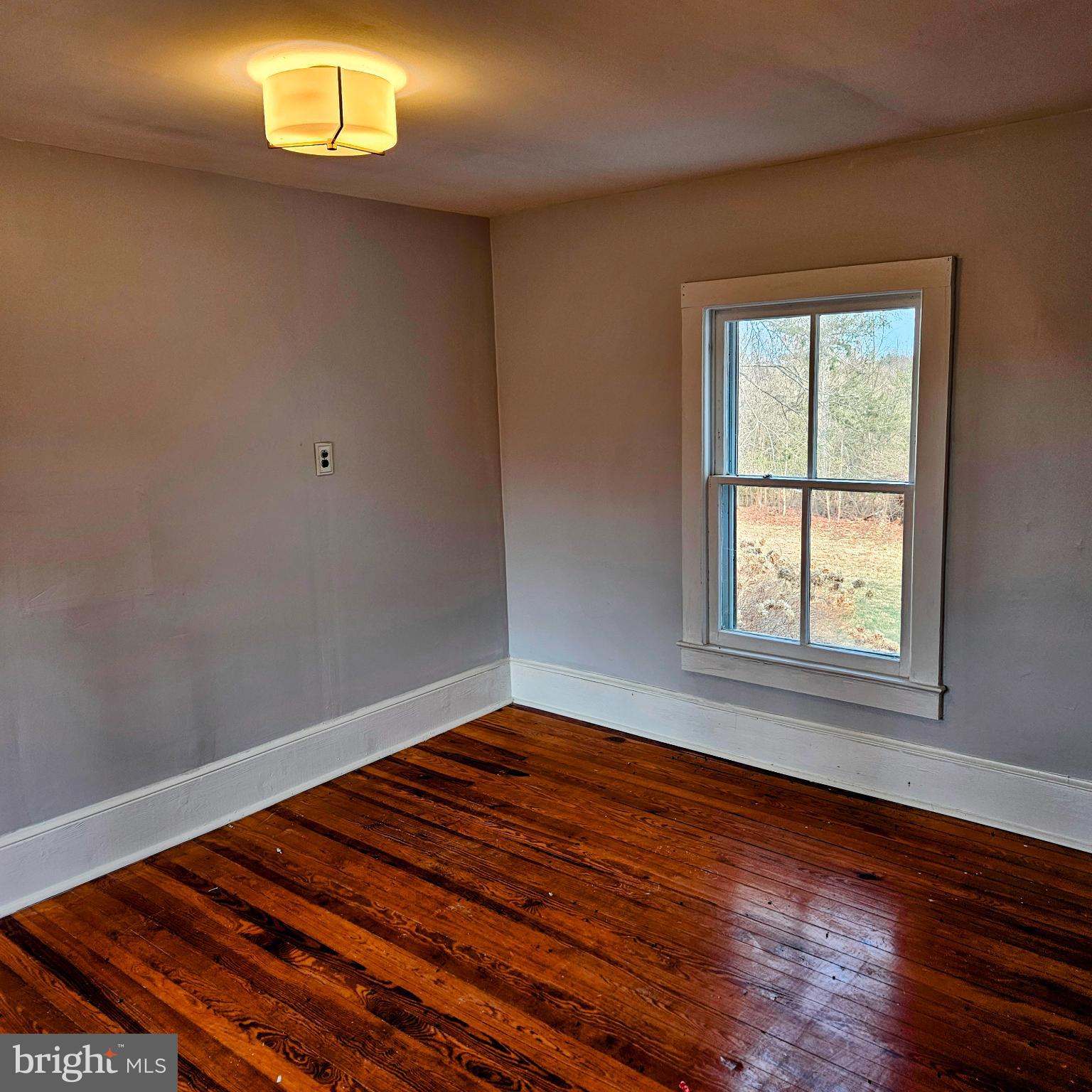 15660 Reva Road Reva, VA 22735 - Photo 40 of 40 wooden floor in an empty room with a window