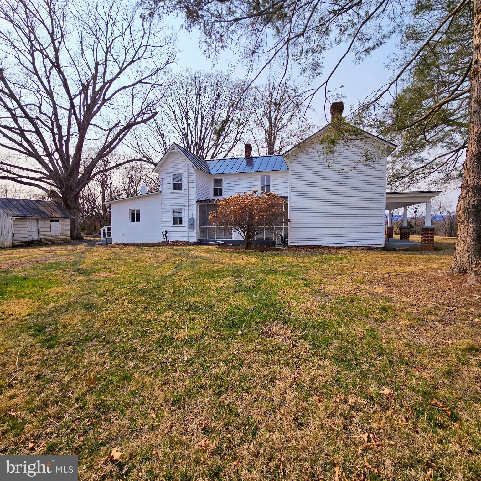 15660 Reva Road Reva, VA 22735 - Photo 7 of 40 a view of a house with a large tree and a yard