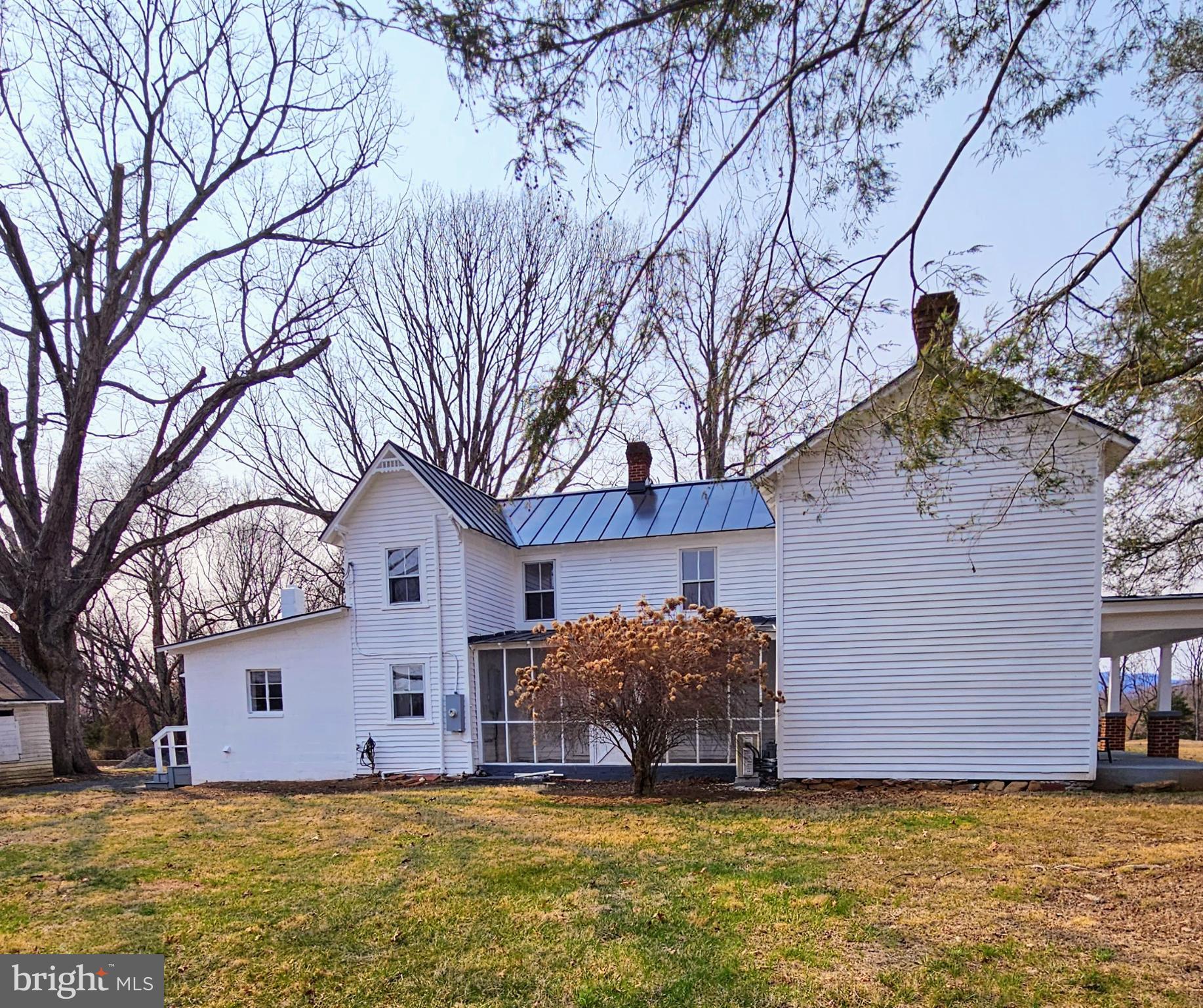 15660 Reva Road Reva, VA 22735 - Photo 8 of 40 a view of a house with a large tree and a big yard