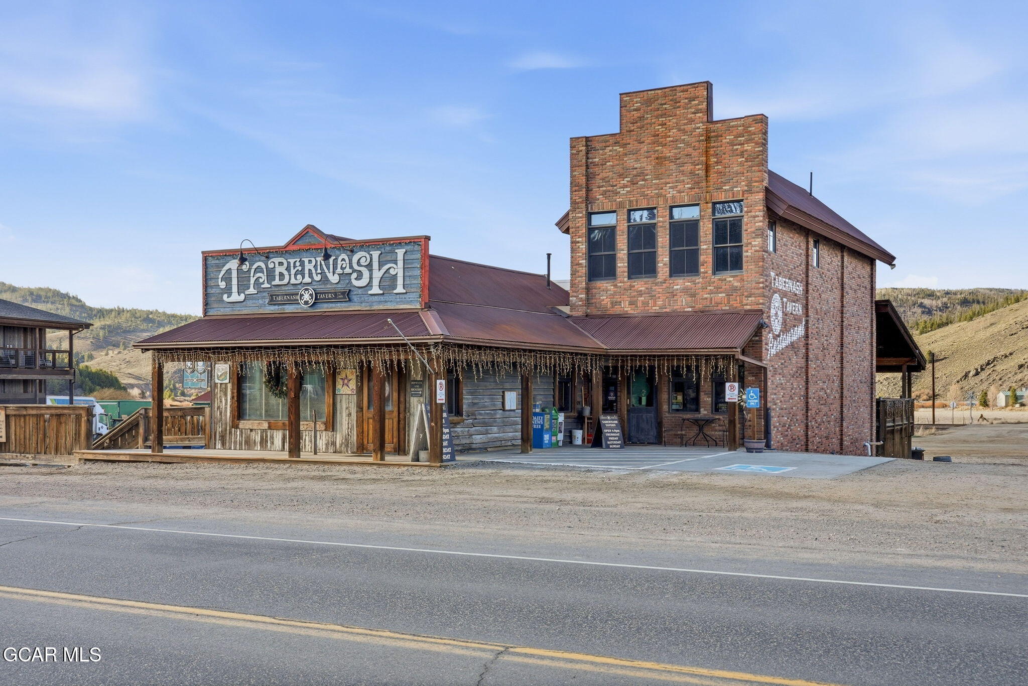 27 County Road Tabernash, CO 80478 - Photo 72 of 96 a front view of a building and a people