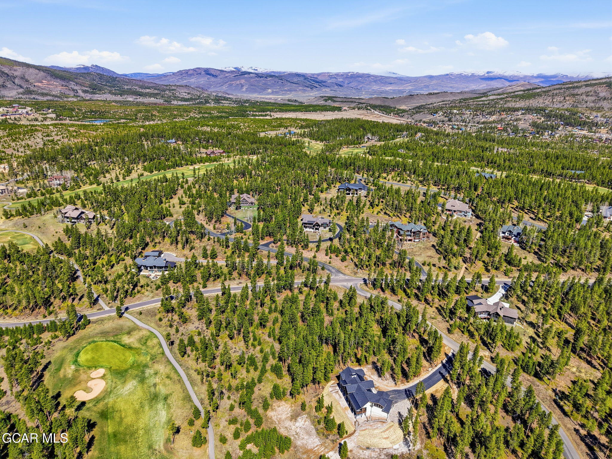 27 County Road Tabernash, CO 80478 - Photo 93 of 96 a view of a lush green hillside and a houses
