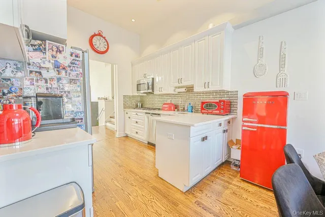 a utility room with cabinets washer and dryer