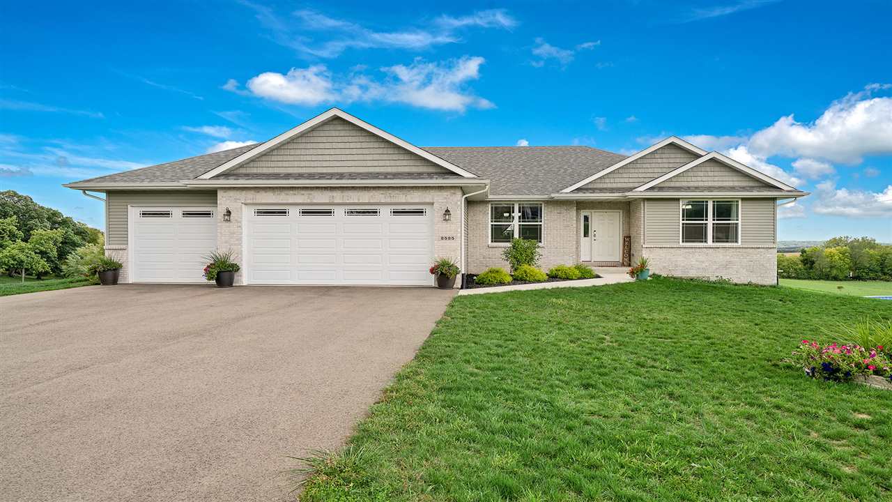 2525 Rogene Drive Oregon, IL 61061 - Photo 1 of 36 a view of a house with a yard and potted plants
