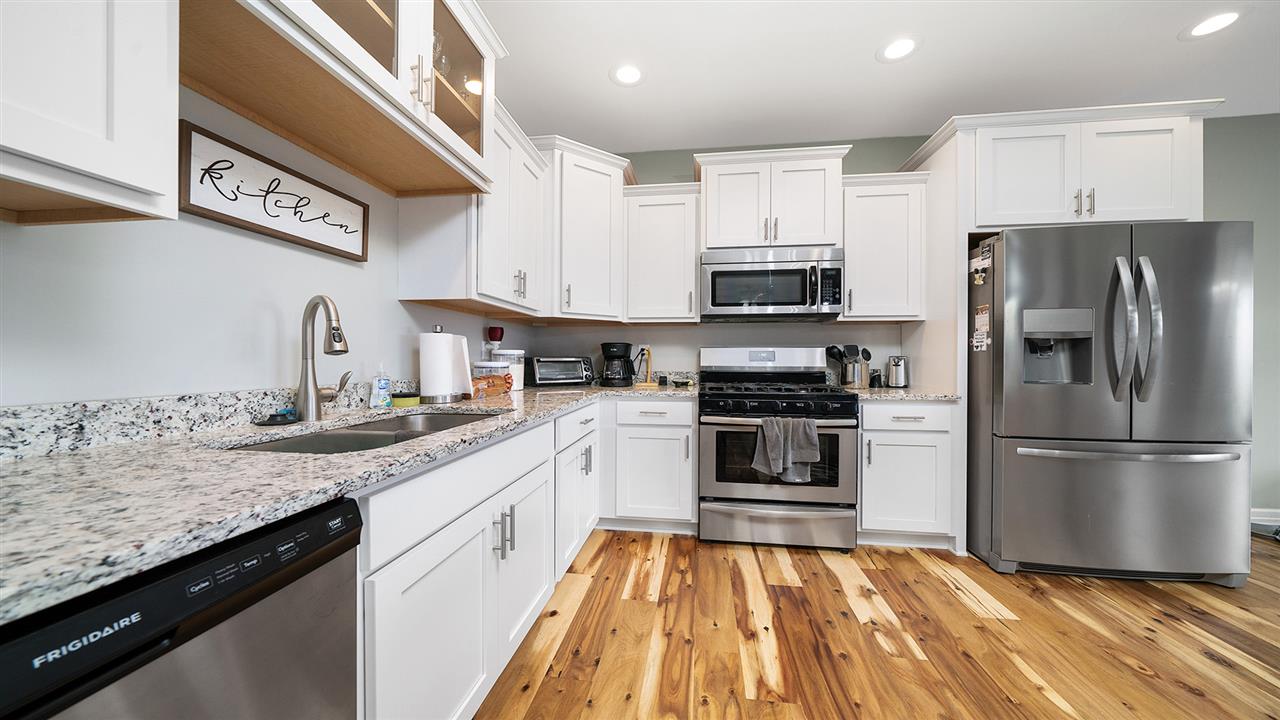 2525 Rogene Drive Oregon, IL 61061 - Photo 15 of 36 a kitchen with granite countertop a refrigerator stove top oven and sink