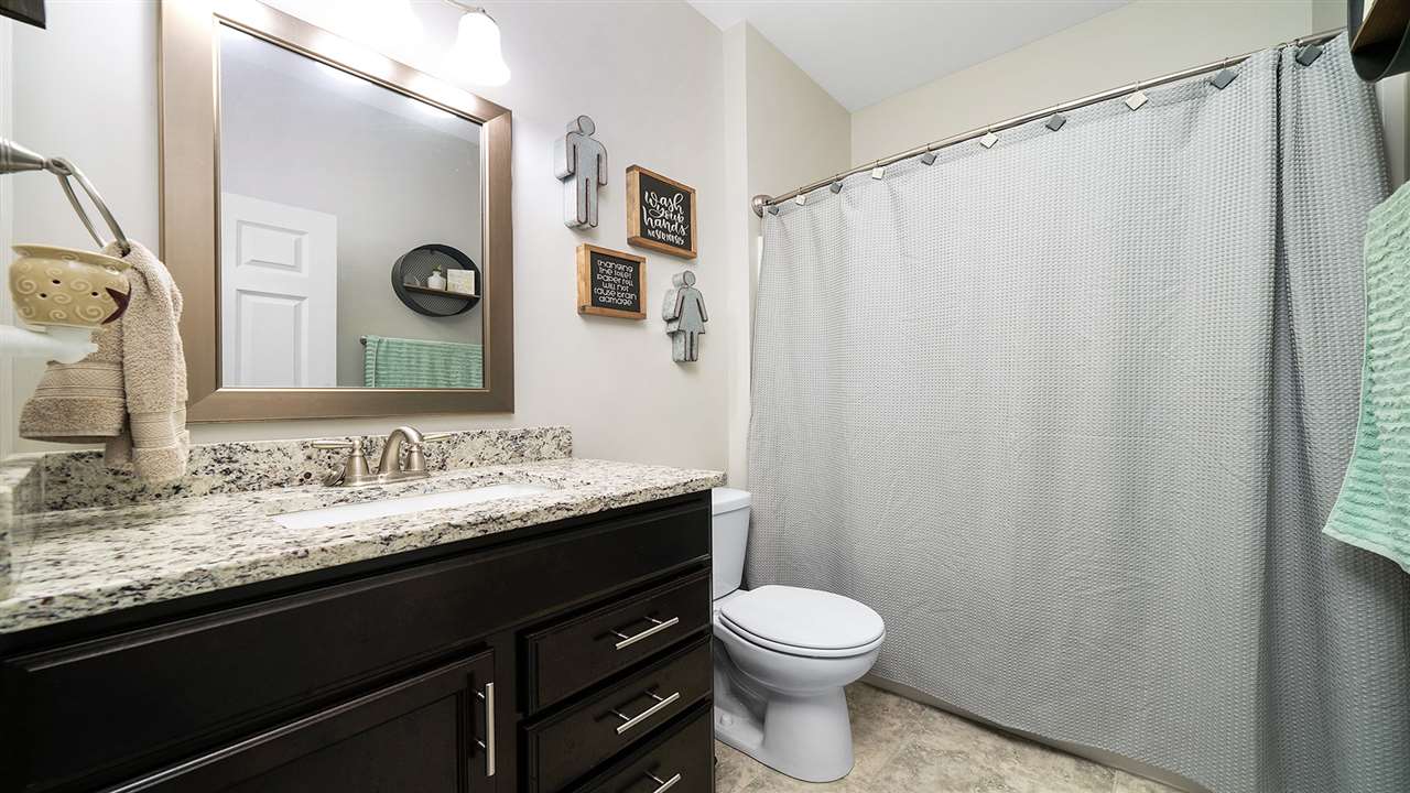 2525 Rogene Drive Oregon, IL 61061 - Photo 24 of 36 a bathroom with a granite countertop sink toilet and shower