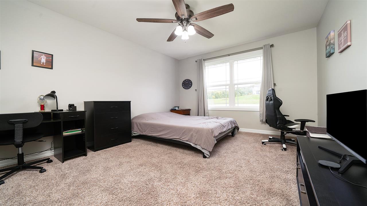 2525 Rogene Drive Oregon, IL 61061 - Photo 25 of 36 a bedroom with a bed and a desk