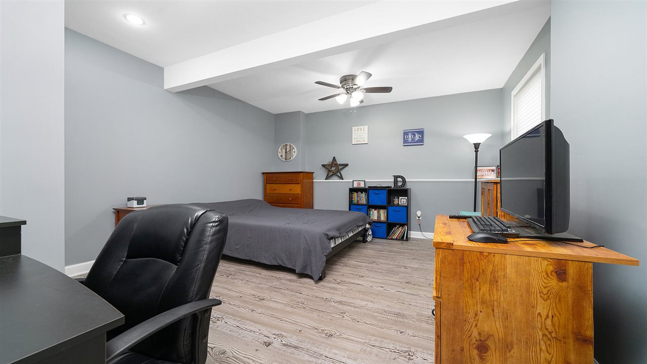 2525 Rogene Drive Oregon, IL 61061 - Photo 27 of 36 a bedroom with furniture and a flat screen tv